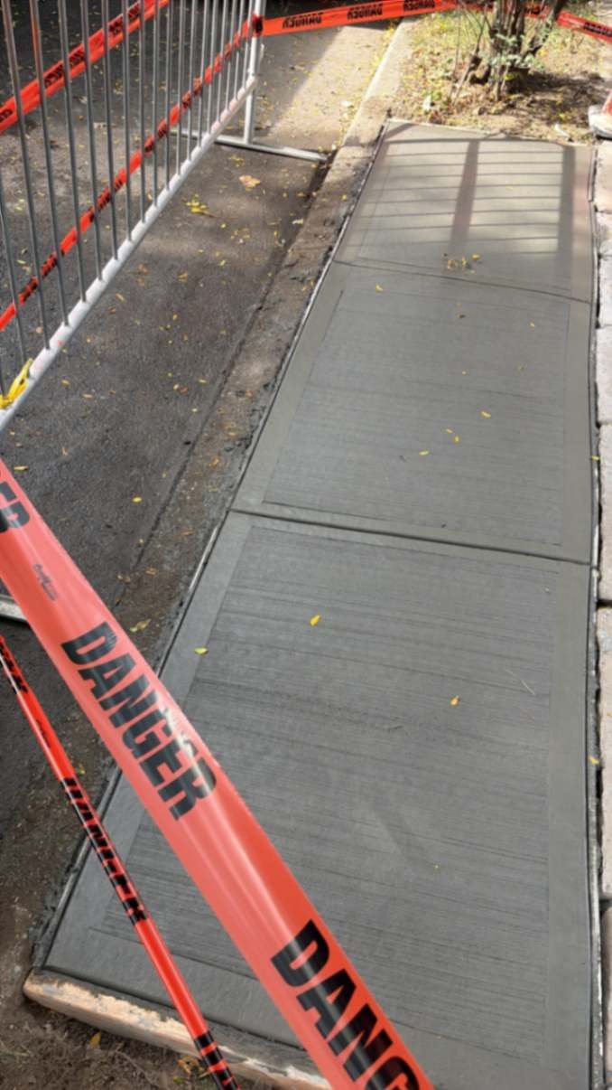 Completed concrete sidewalk beside the street tree pit on Argyle Road, Brooklyn