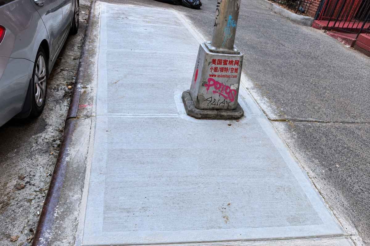 Sidewalk after DOT violation repair in Flushing, Queens
