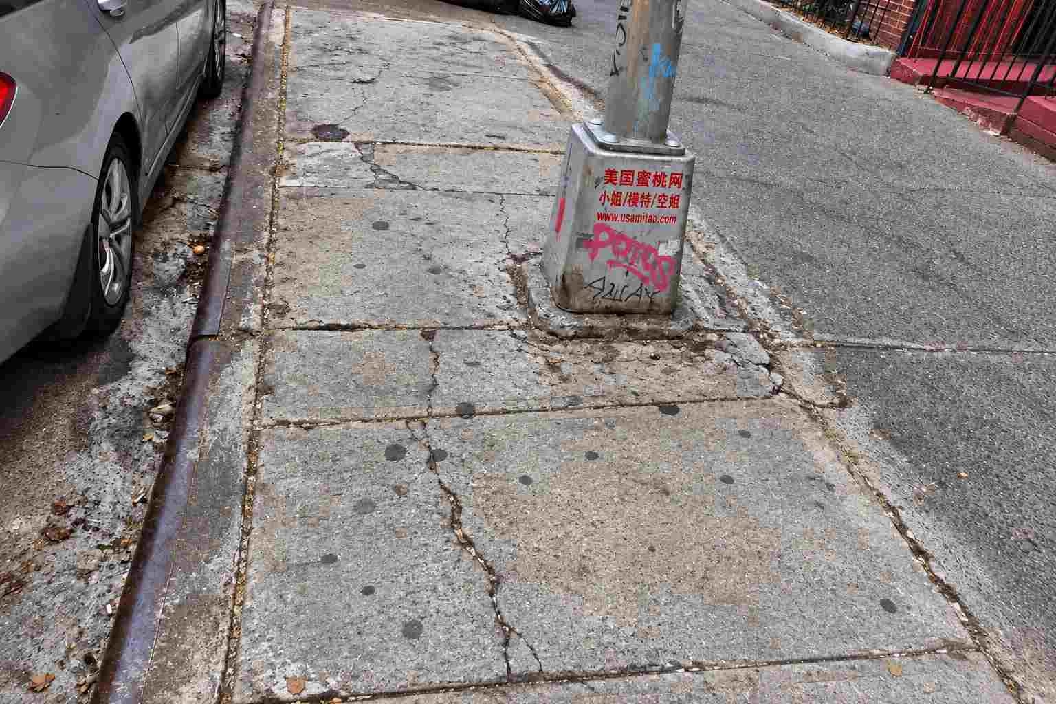 Damaged sidewalk slabs before DOT violation repair at 143-48 41st Ave, Flushing, Queens